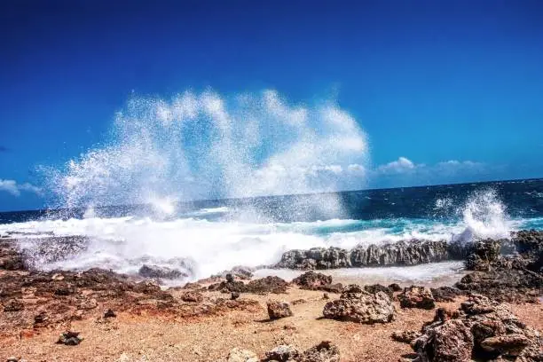 Big wave on a rocky beach