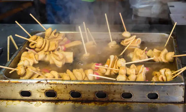 Oden, fish balls and cakes on wooden sticks  in the boiled soup in South Korea