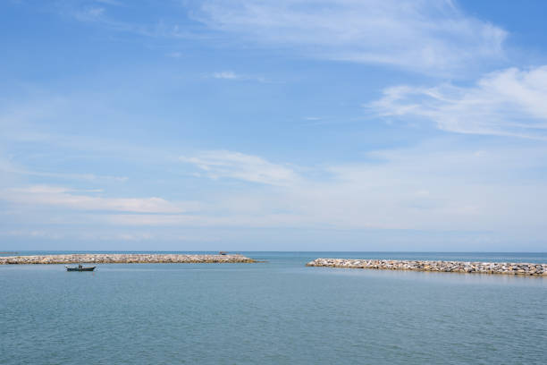 istock Calm blue ocean with rock, no wave and blue sky 1011035668