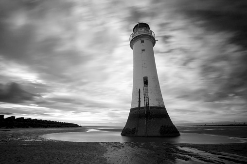 Lighthouse on beach.  Black and White.  Long Exposure.