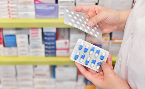 istock Hand holding medicine capsule pack 1011058626
