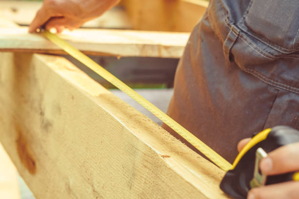 istock the worker makes measurements with a tape measure 1011058748