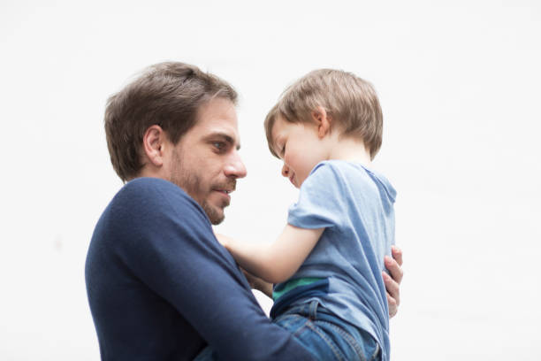 istock Young Father and Son Indoors 1011077014