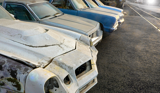 old cars at auto salvage junkyard