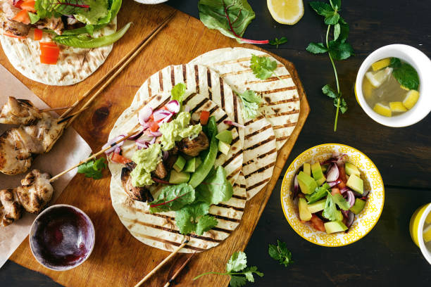istock chicken tacos grill vegetable salsa, guacamole sauce 1011085272