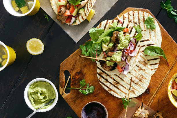 istock chicken tacos grill vegetable salsa, guacamole sauce 1011085340