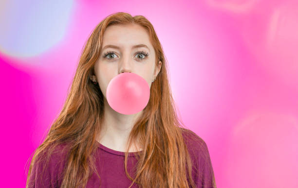 istock Woman with huge gum bubble 1011098944