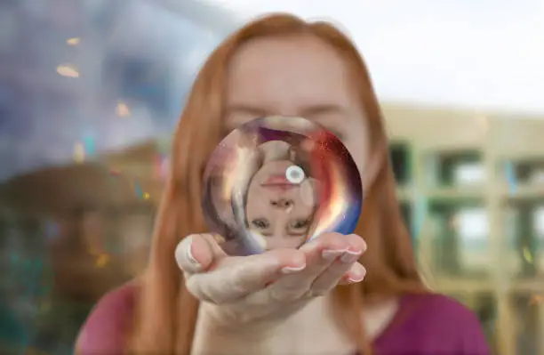 Woman holding reflective ball