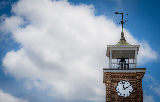 A clocktower displays a 1:58pm time.