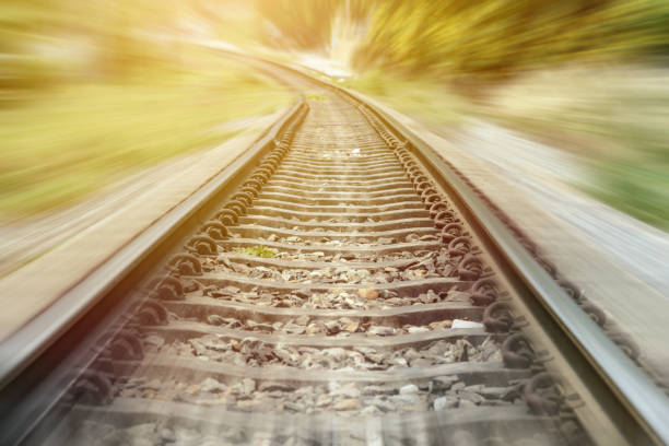 istock landscape of railroad tracks, railway track with motion blur effect 1011101092