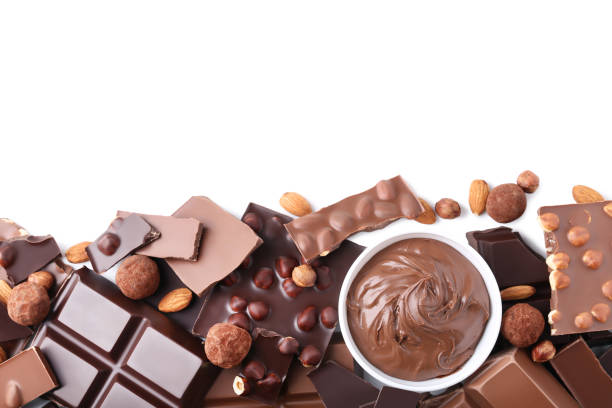 istock Chocolate pieces with nuts and bowl on white background 1011110064