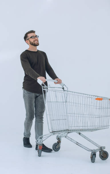 istock young man with a shopping cart steps forward 1011112790