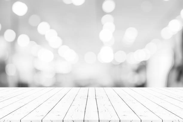 istock Perspective empty white wooden table on top over blur background, can be used mock up for montage products display or design layout. 1011115576