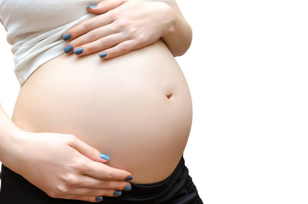 istock The pregnant woman on white background. 1011146086