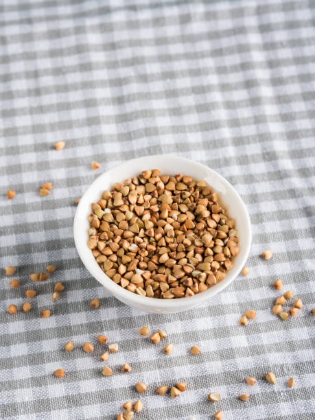 istock Gluten free grain buckwheat in bowl on kitchen table 1011146684