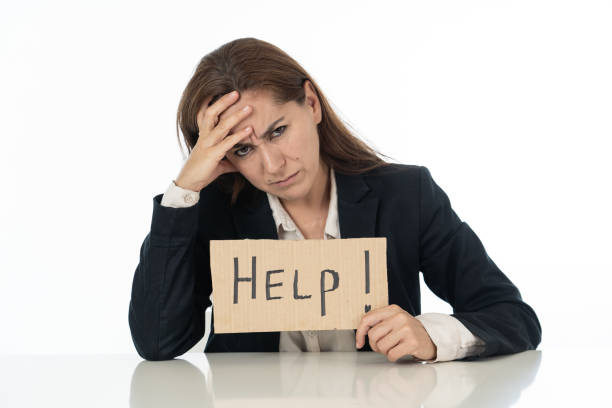 istock Sad businesswoman holding a help sign 1011146690