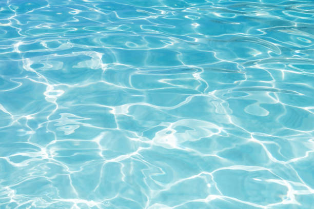 istock Blue swimming pool rippled water background 1011159862