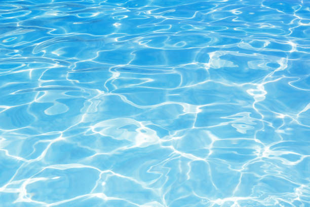 istock Blue swimming pool rippled water background 1011159920