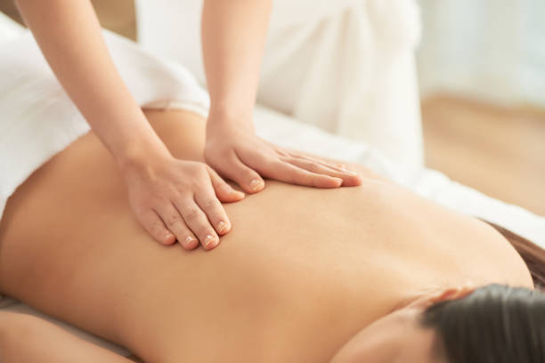 istock Crop hands rubbing back of woman 1011160422