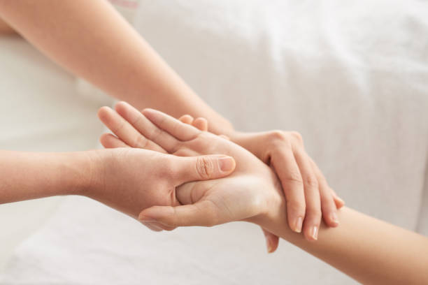 istock Crop hands massaging wrist and palm 1011160490