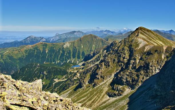 istock High rocky mountains under blue sky in a sunny day 1011168752