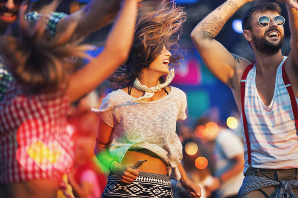 istock Friends dancing at a concert. 1011169208
