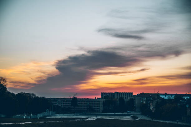 istock orange clouds with blue sky on sunset. copy space 1011181742