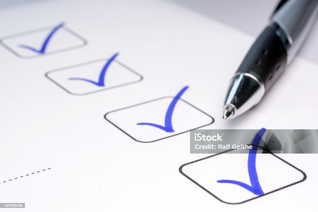Check off completed tasks on a to-do list check marks Checklist Stock Photo