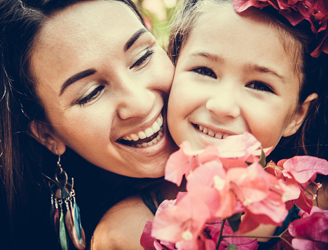 Outdoor Portrait Of Loving Mother And Daughter