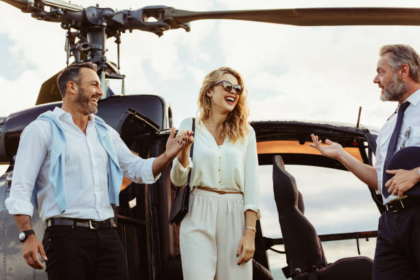 istock Couple travel by private helicopter 1011187678