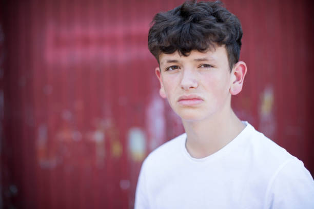 Head And Shoulders Portrait Of Serious Teenage Boy Head And Shoulders Portrait Of Serious Teenage Boy 14 15 years photos stock pictures, royalty-free photos & images