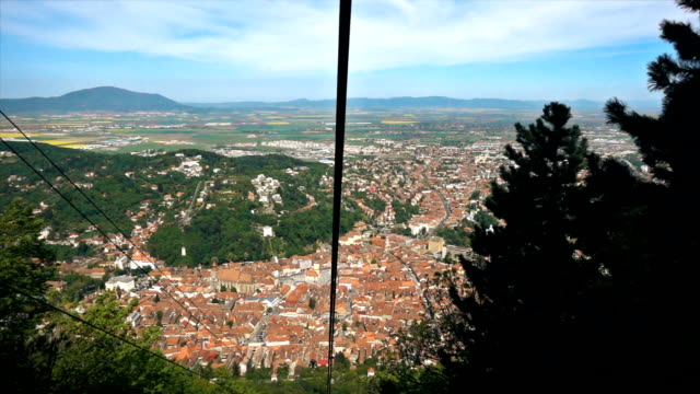 Cable car descending from Tampa hill revealing Brasov City, Romania