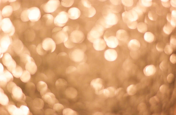 istock Bright golden background with big bokeh lights 1011197704