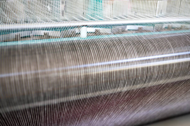 istock spindle with white yarn in the jean factory 1011202302