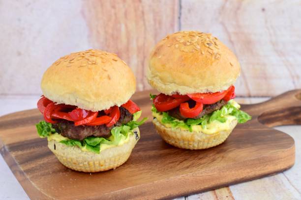 istock Flax seed bread buns with bean patty, lettuce and bell pepper 1011202418