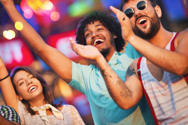 istock Friends dancing at a concert. 1011203698