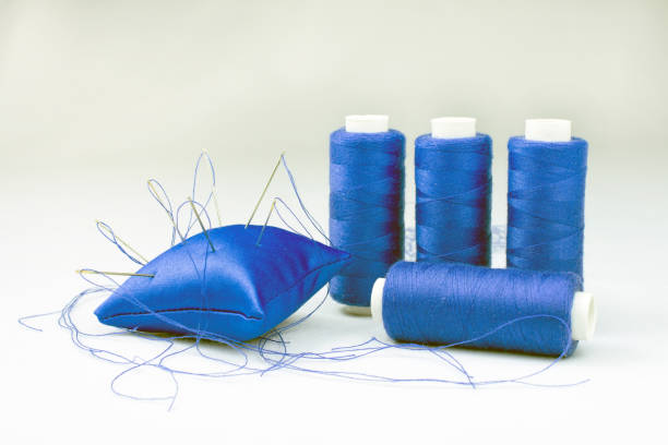 istock blue threads on reels pincushion for needles 1011205168