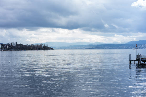 istock pier at lake zurich with clouds and blue water 1011208360