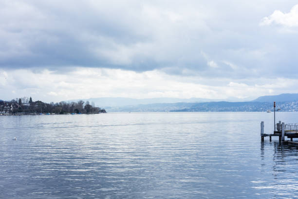 istock pier at lake zurich with clouds and blue water 1011208394
