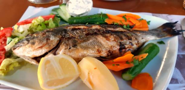 istock Oven baked sea bream 1011210414
