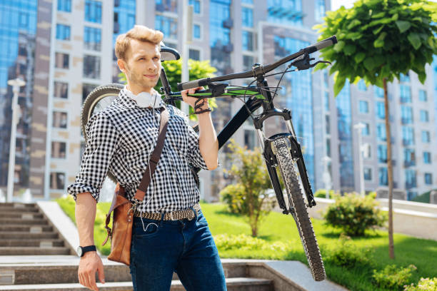 istock Pleasant strong man holding his vehicle 1011210632