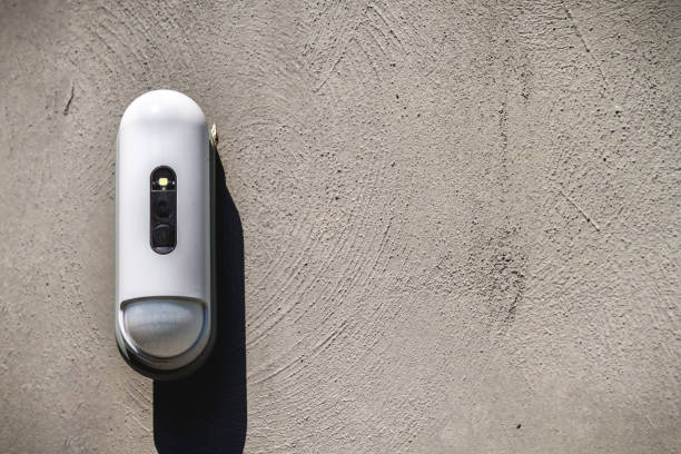 istock Surveillance Camera With Movement Detector outside on Concrete Wall 1011215096