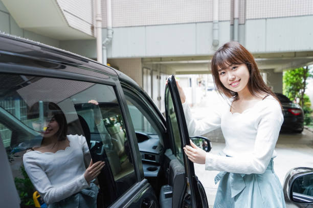 istock Woman go into a car 1011222644