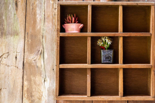istock Nine boxes wooden shelf with flower pots 1011231742