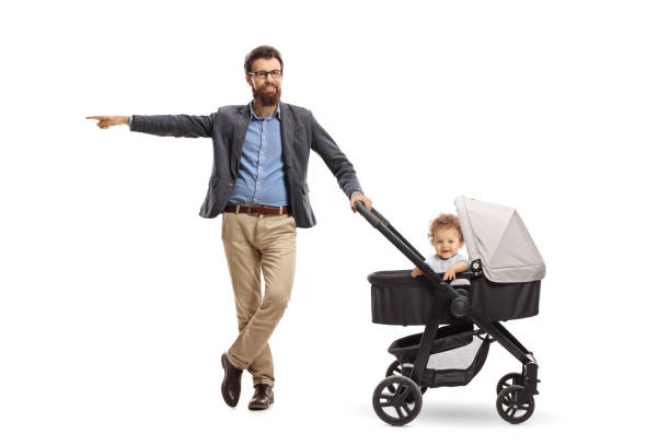 istock Father with a baby boy in a stroller pointing 1011231990