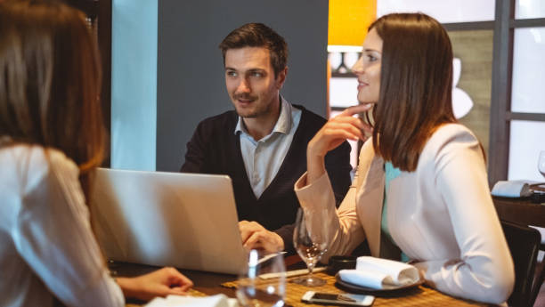 istock Business people talking at a restaurant 1011235038