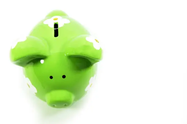Grreen piggy bank isolated on a white background