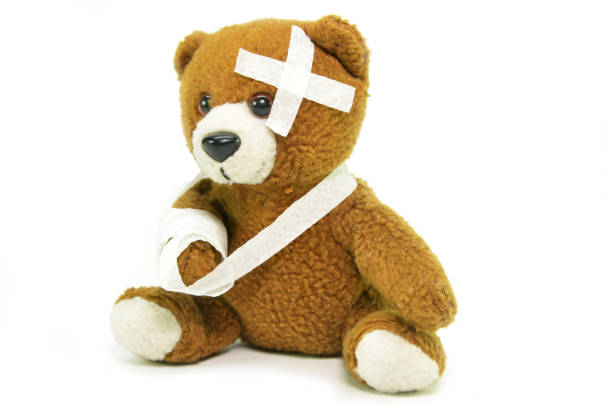 istock Injured teddy bear with bandages 1011245910