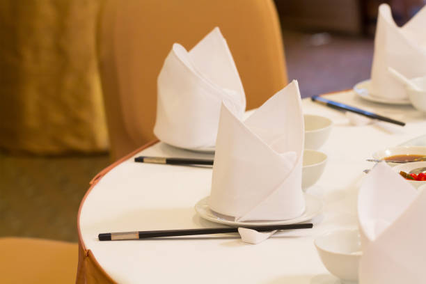 istock white napkin and chinese table setting in Chinese banquet party. 1011250206