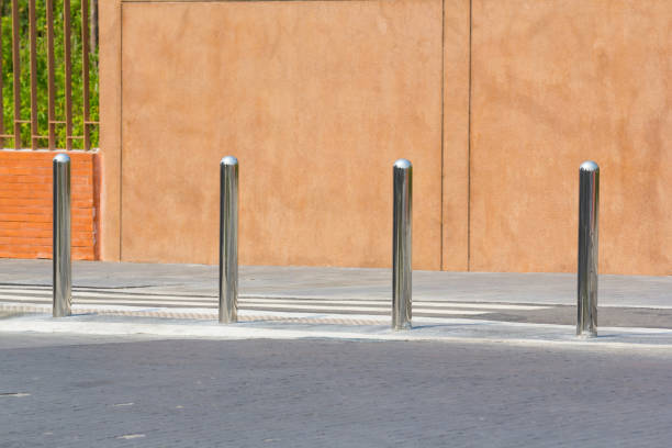 istock stainless steel bollards on footpath 1011250248